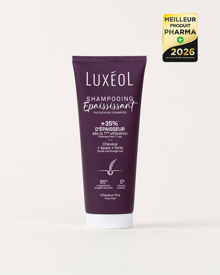 Purple shampoo tube labeled 'Luxéol' on a white background with a gold award badge.